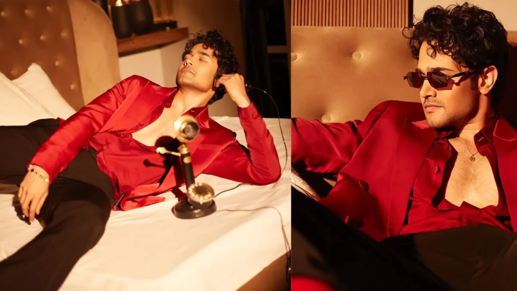 Bhuvan Bam relaxing in a red satin shirt showcasing his luxurious lifestyle – Bhuvan Bam Net Worth 2025